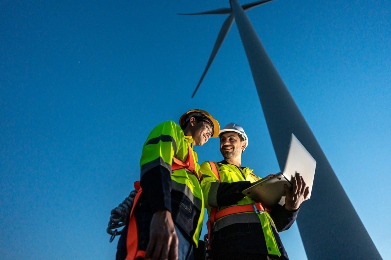 diverse-ethnicity-male-technicians-working-in-the-wind-turbines-field-.jpg